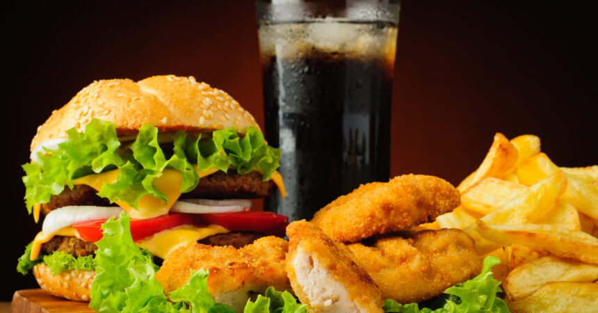 Burger, chicken nuggets, french fries and cola drink AdobeStock_56254847-scaled-aleftcenter.jpeg